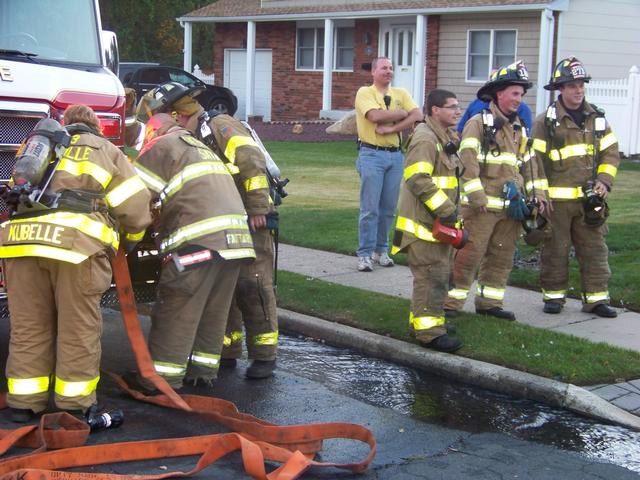 Members of the Engine crew repacking the hoseline !