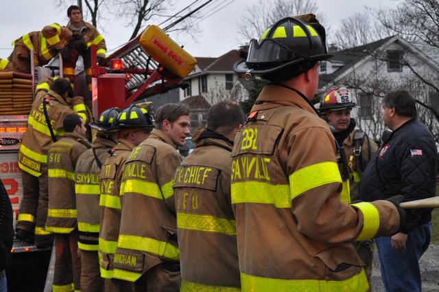 Teamwork at its best...repacking hose after Signal 13 on Roosevelt Avenue.